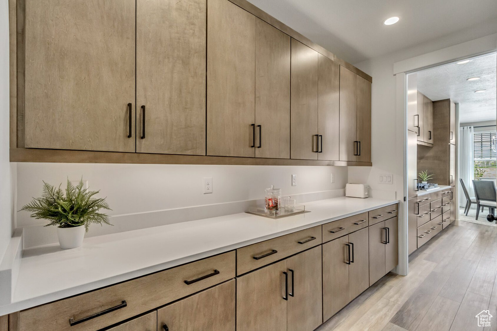 Kitchen featuring recessed lighting, light wood-style floors, and light countertops