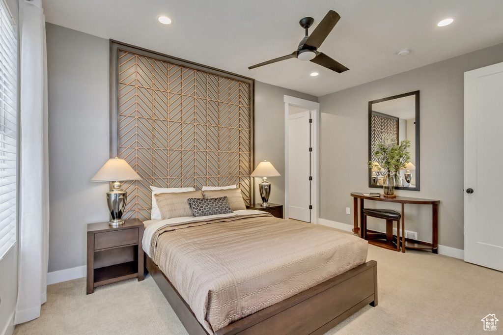 Bedroom featuring recessed lighting, baseboards, and light carpet