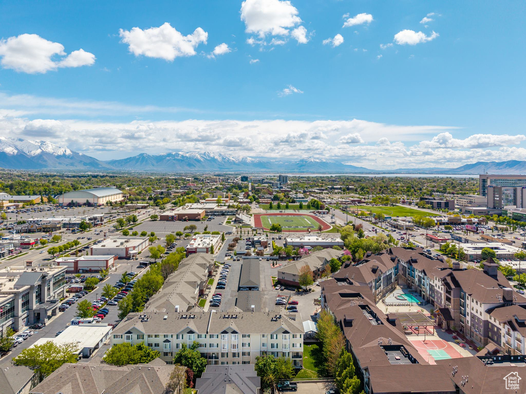 Birds eye view of property with a mountain view