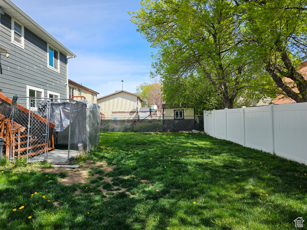 View of yard with a fenced backyard