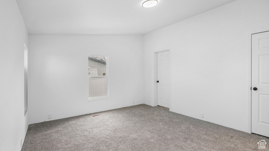 Spare room with carpet floors