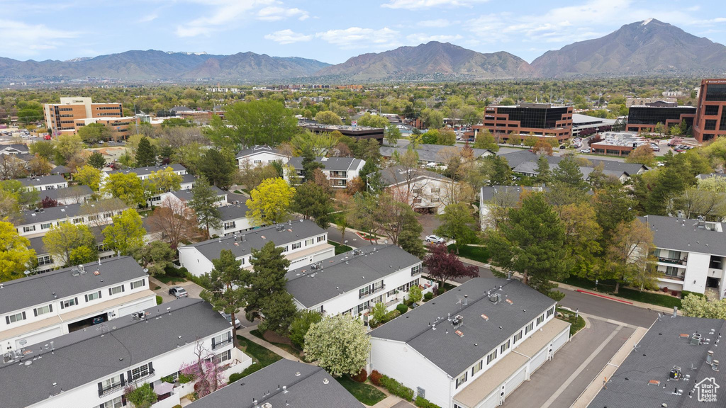 Birds eye view of property with a residential view and a mountain view