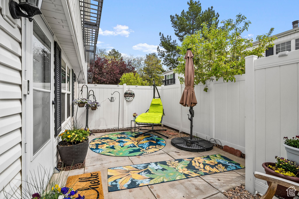 View of patio with a fenced backyard