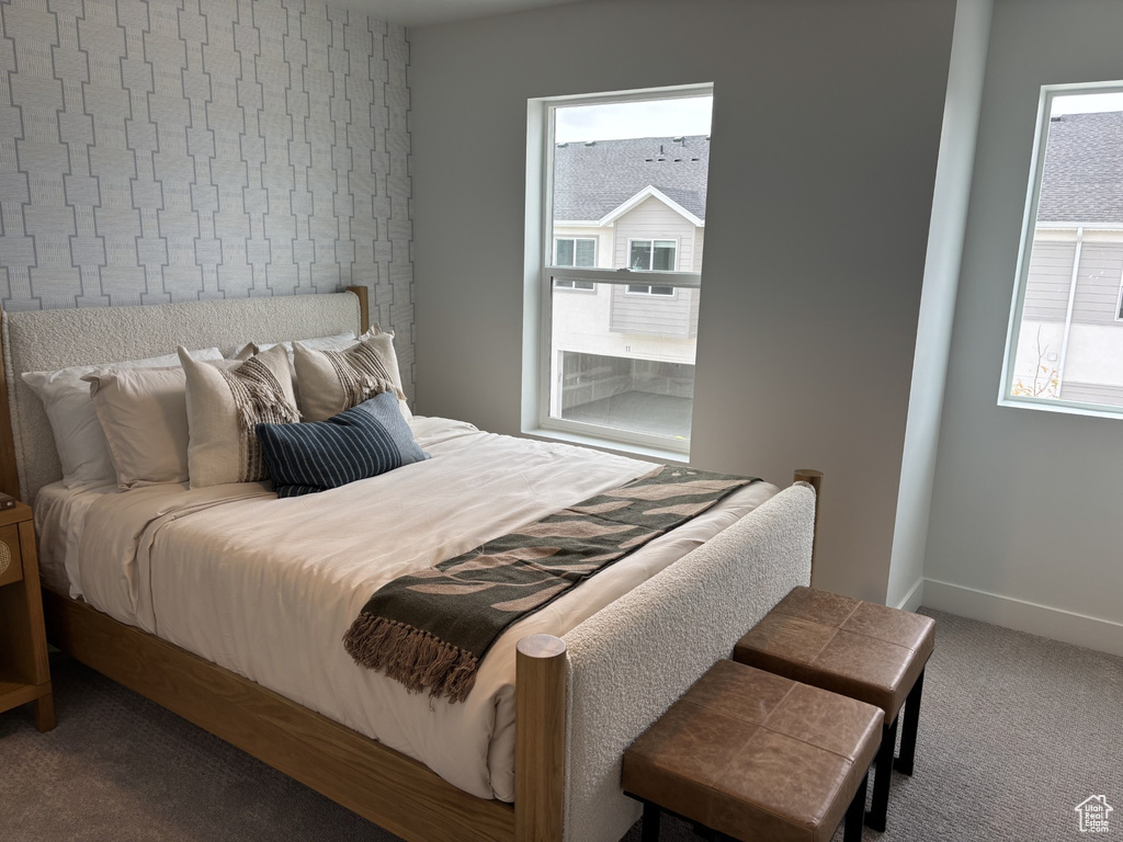 Carpeted bedroom with baseboards