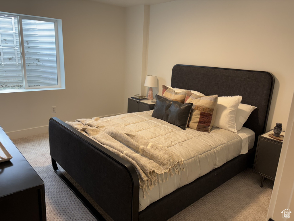 Bedroom with carpet and baseboards