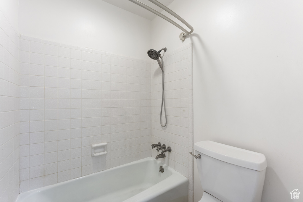 Full bathroom featuring shower / bathing tub combination and toilet