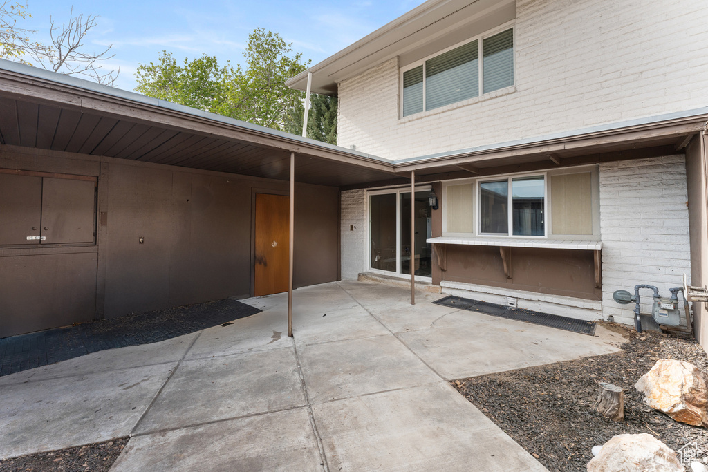 Entrance to property with brick siding