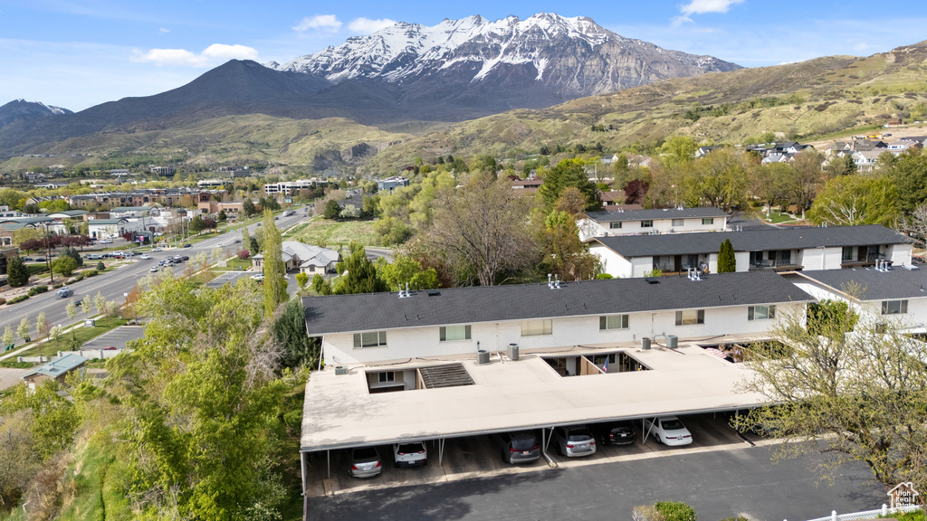Drone / aerial view with a residential view and a mountain view