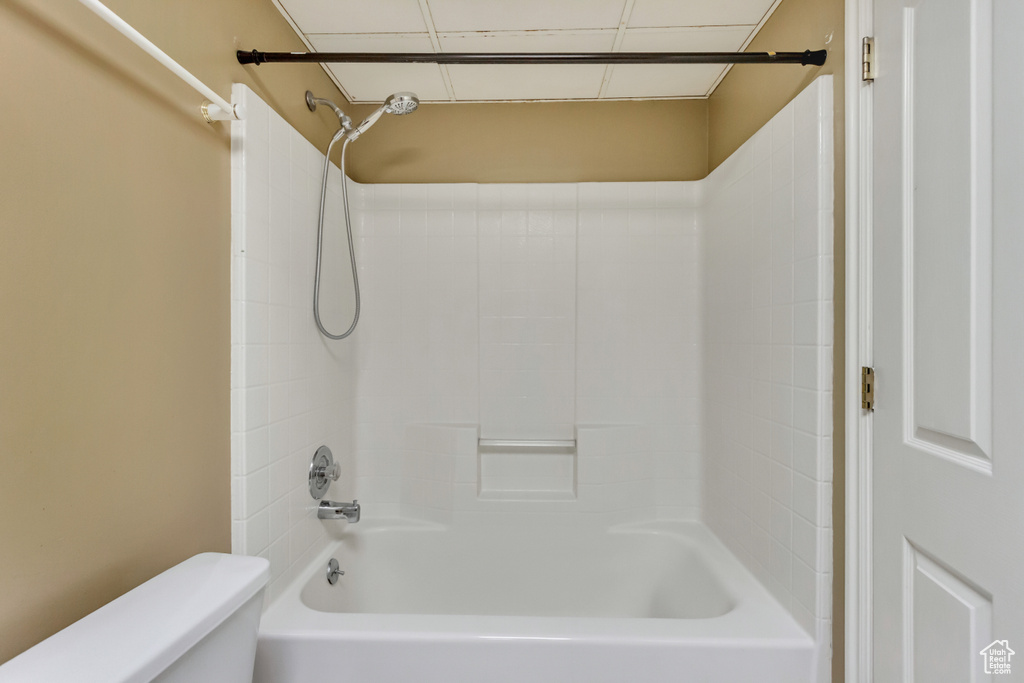 Bathroom with bathing tub / shower combination and toilet