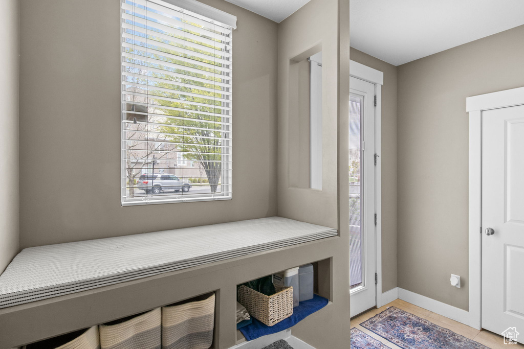 Interior space with plenty of natural light, baseboards, and light tile patterned floors