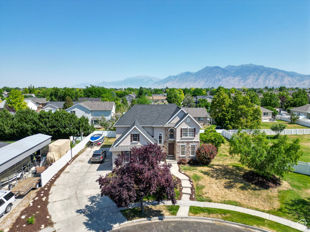Birds eye view of property with a residential view and a mountain view