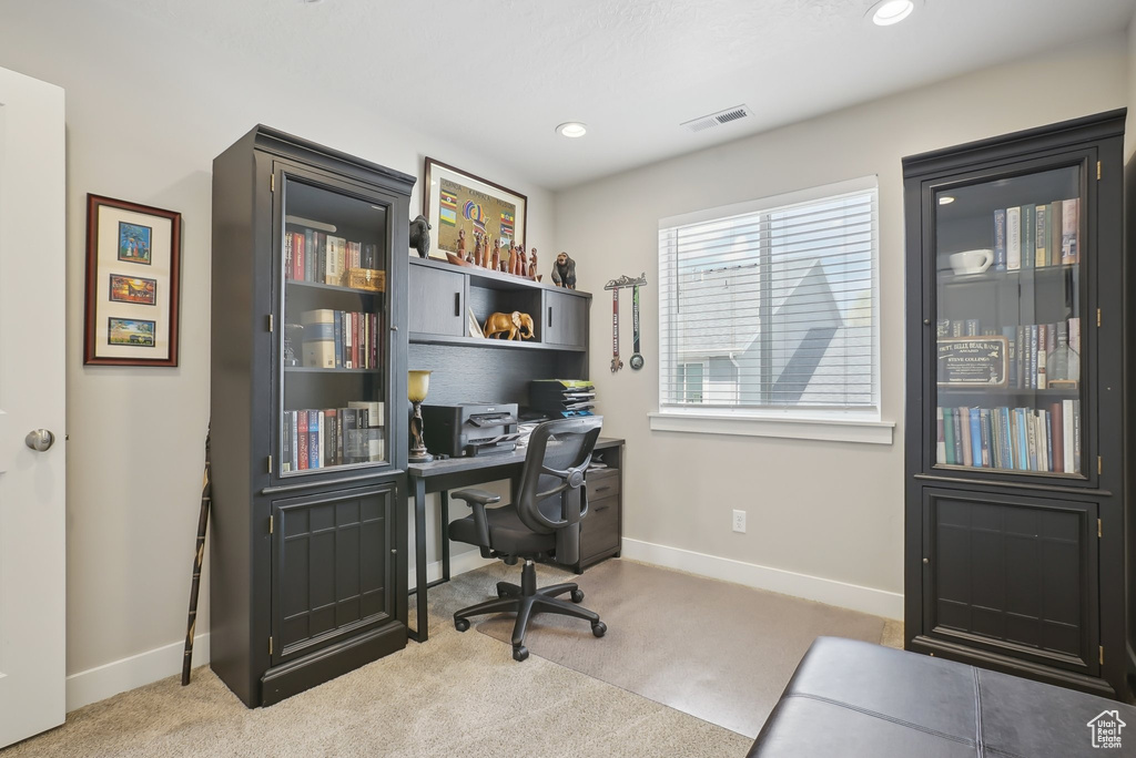 Office space with recessed lighting, visible vents, carpet floors, and baseboards