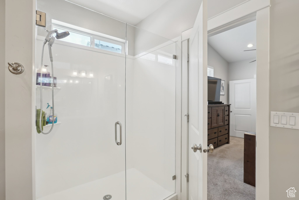 Full bath with vanity and a shower stall