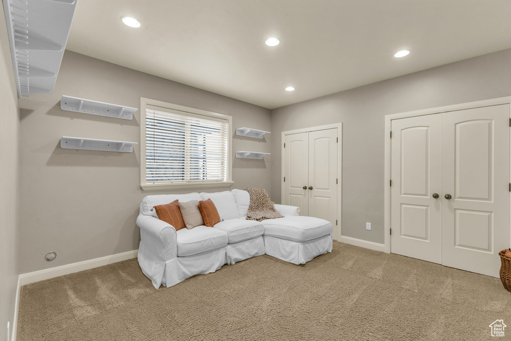 Sitting room featuring recessed lighting, carpet flooring, and baseboards
