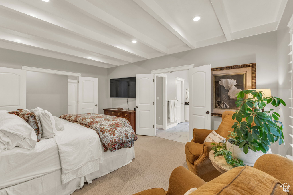 Bedroom with beamed ceiling, light tile patterned floors, and recessed lighting