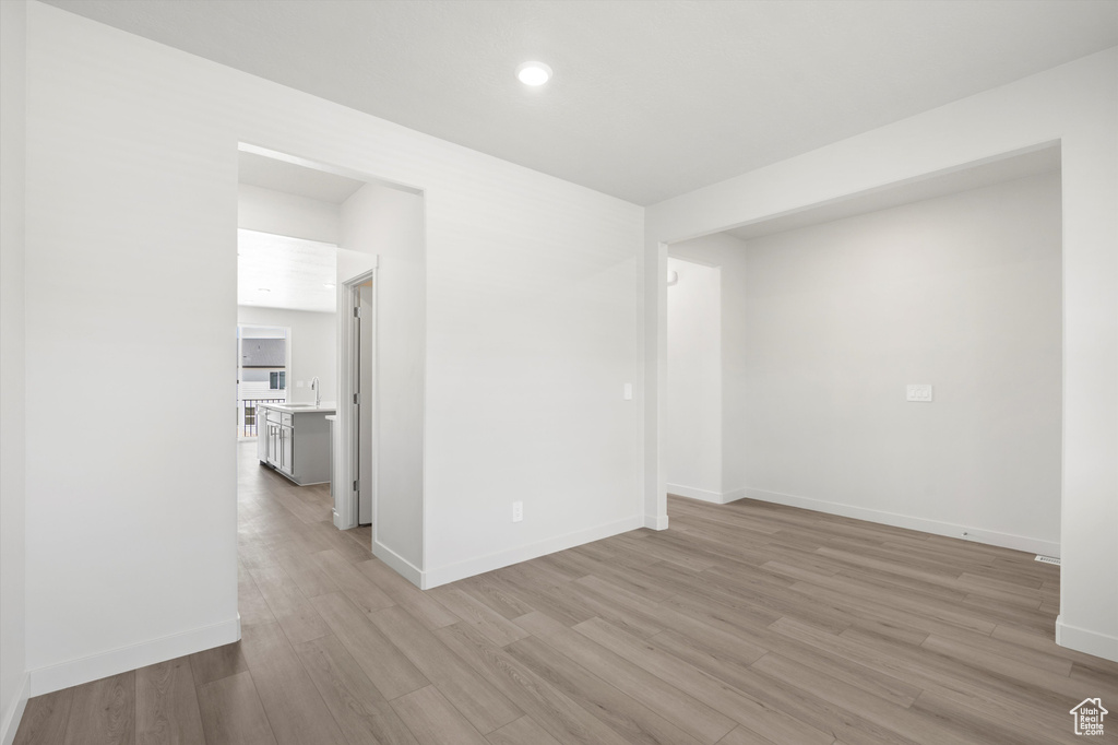 Unfurnished room featuring light wood finished floors and recessed lighting