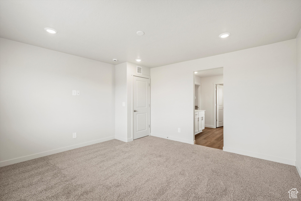 Spare room with carpet flooring and recessed lighting
