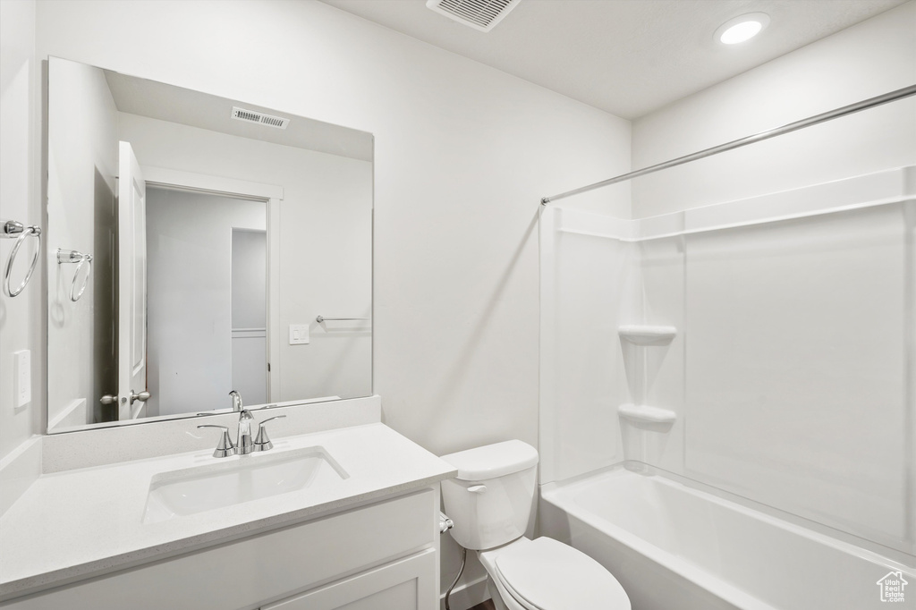 Full bath with vanity,  shower combination, and recessed lighting