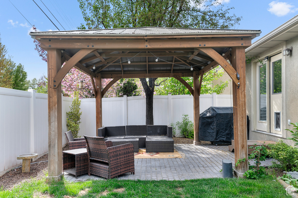 View of patio / terrace featuring a fenced backyard, a gazebo, and an outdoor hangout area