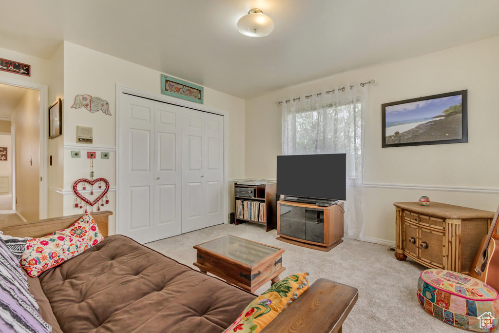 Living room featuring light carpet