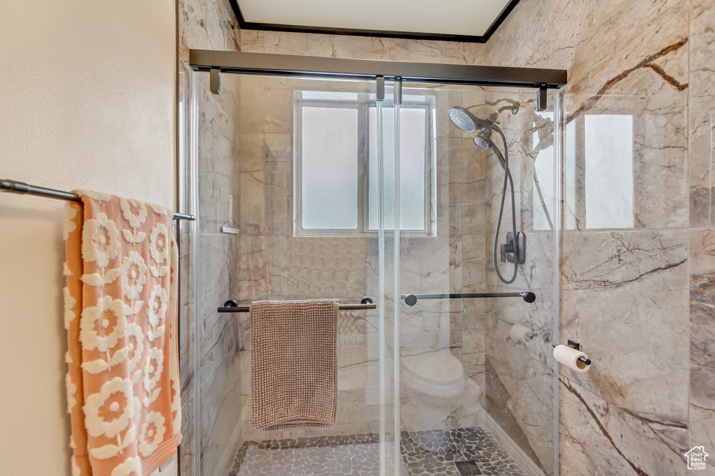 Full bathroom with a shower stall