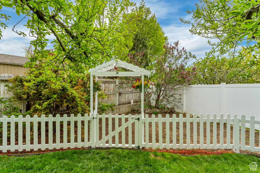 View of yard with a gazebo and fence private yard