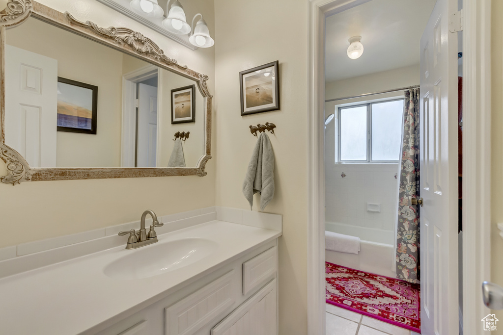 Full bath featuring shower / tub combo, tile patterned floors, and vanity