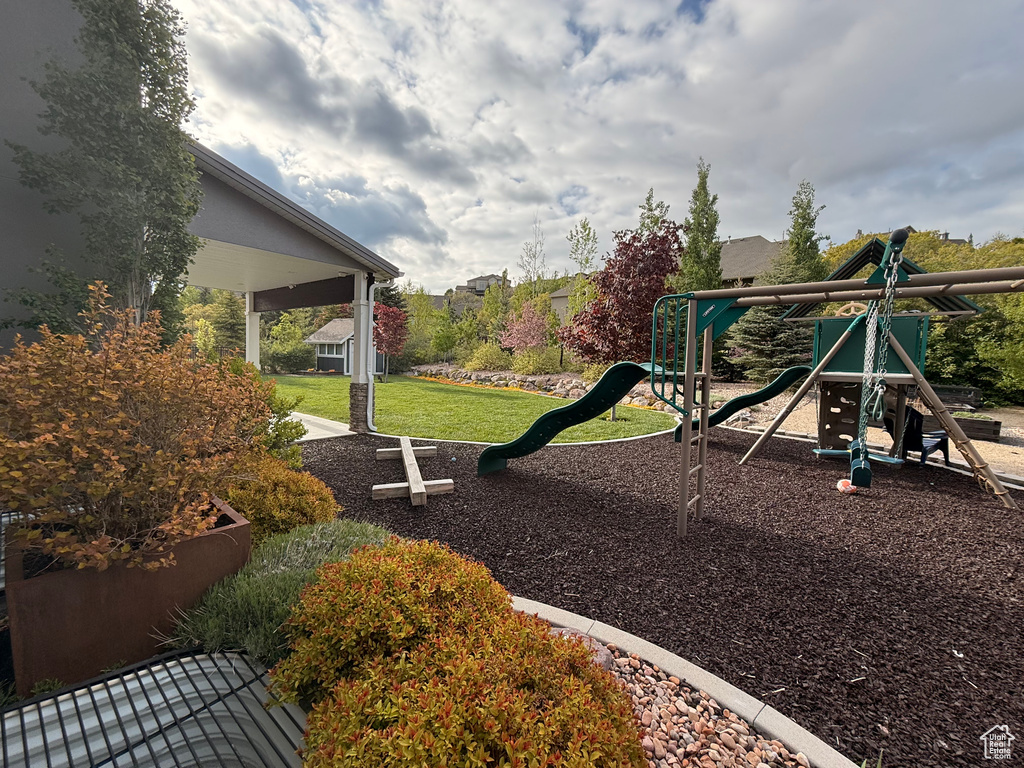 View of play area with a lawn