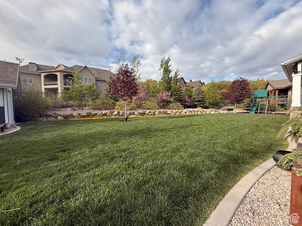 View of yard featuring a playground