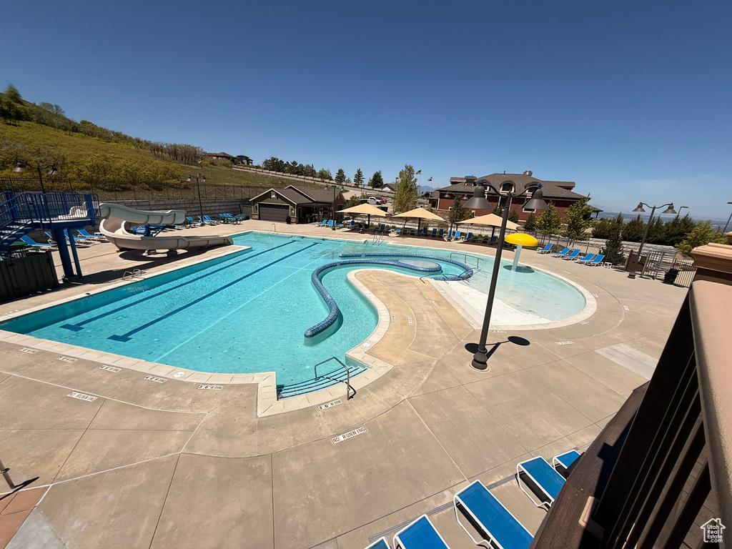 Community pool featuring a patio area