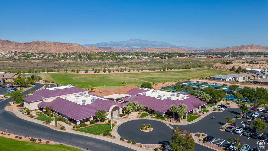 Aerial view of a mountain backdrop and a golf club