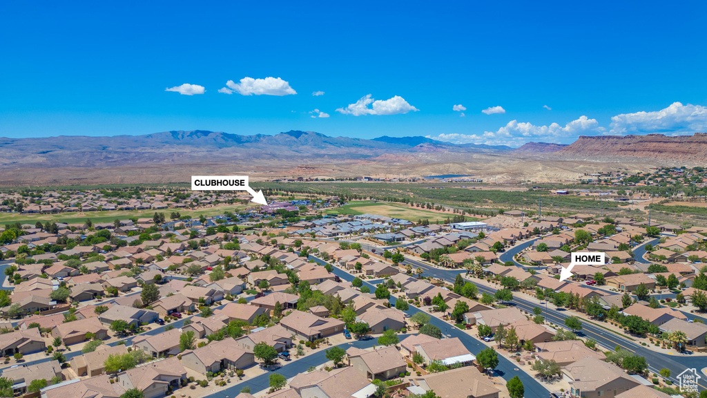 Aerial view of residential area with a mountainous background