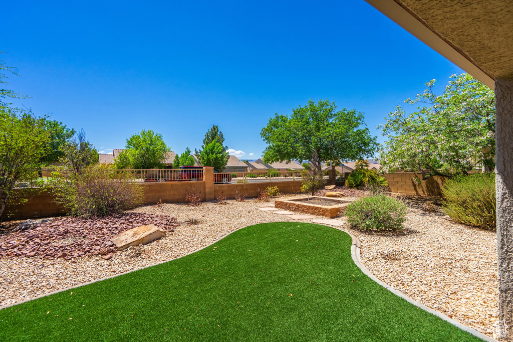 View of fenced backyard