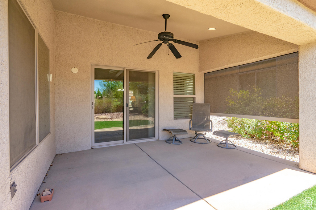 View of patio featuring a ceiling fan