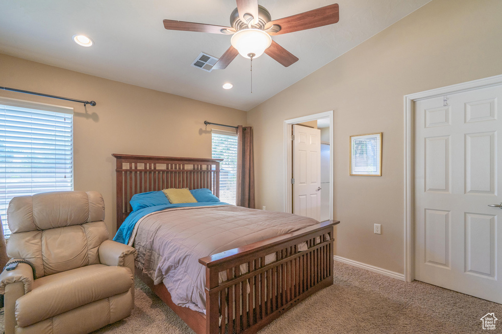 Bedroom featuring light colored carpet, lofted ceiling, baseboards, recessed lighting, and ceiling fan