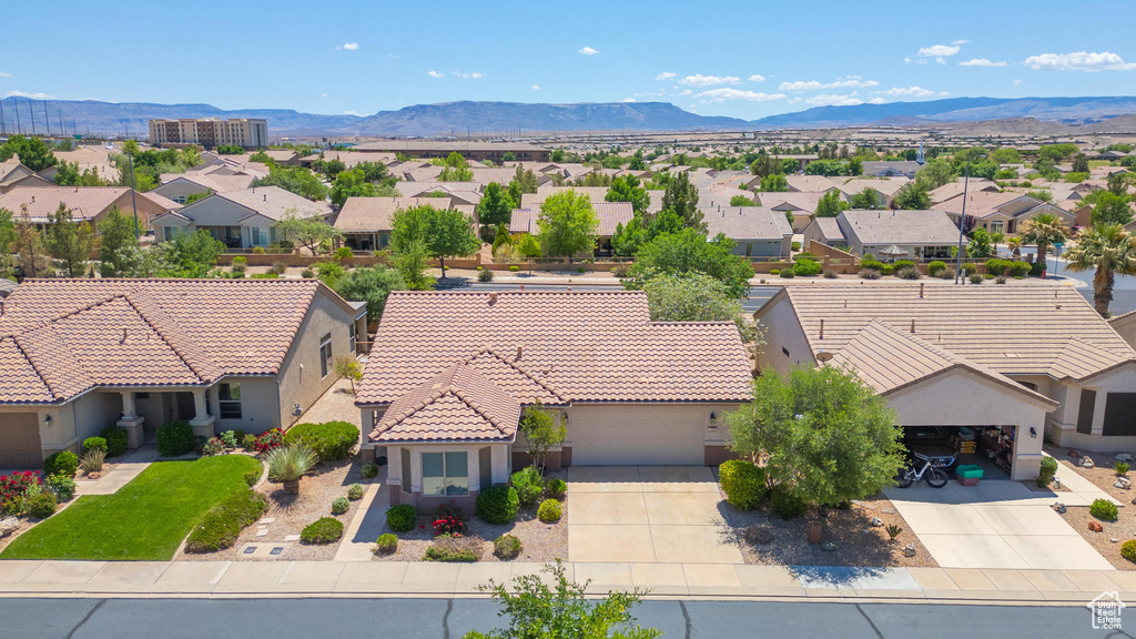Aerial view of residential area featuring mountains