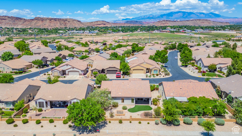 Aerial perspective of suburban area featuring a mountain backdrop