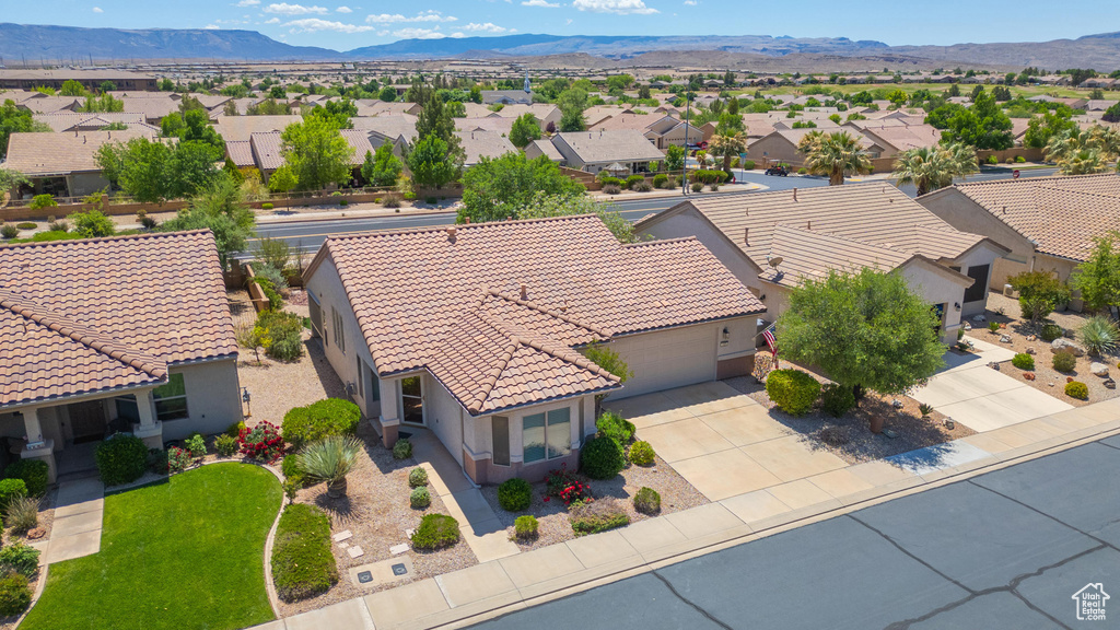Aerial view of residential area featuring a mountain backdrop