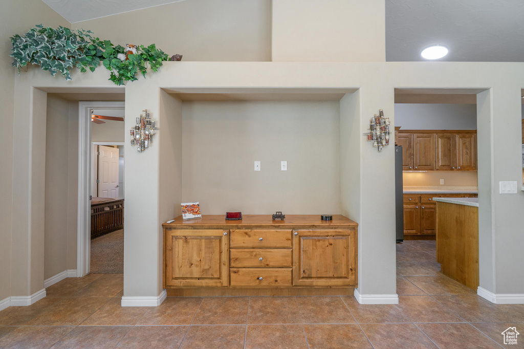Detailed view of a ceiling fan and baseboards