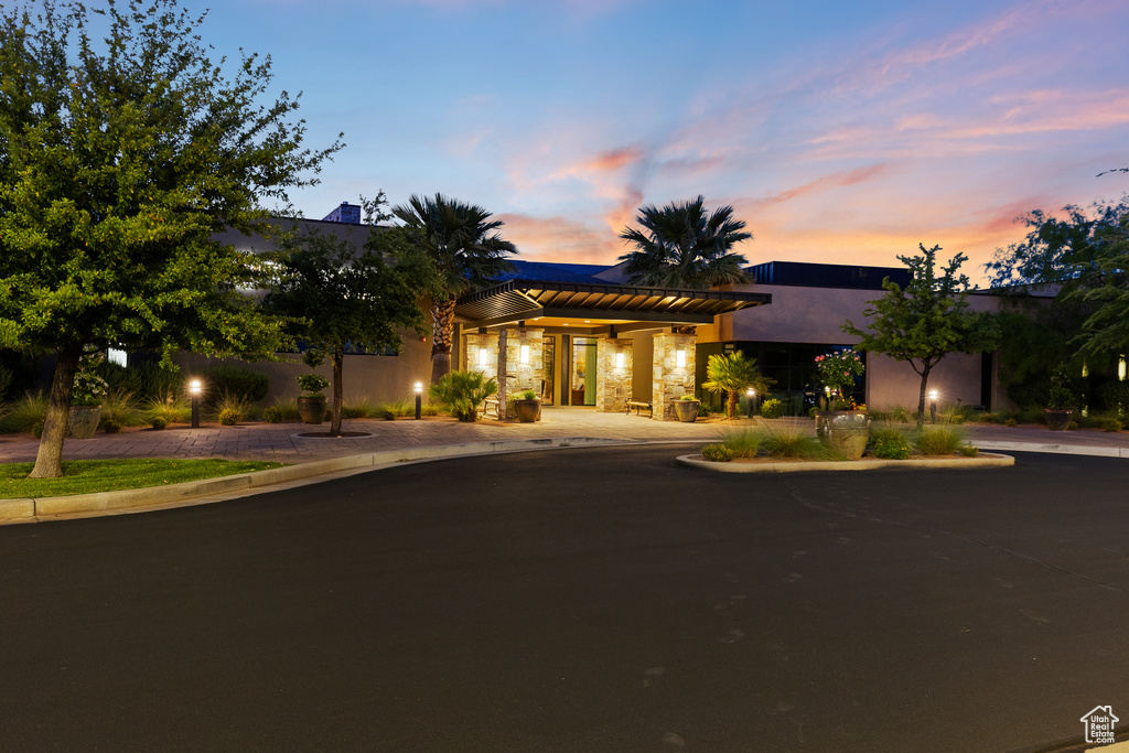 View of front of property featuring stucco siding and stone siding