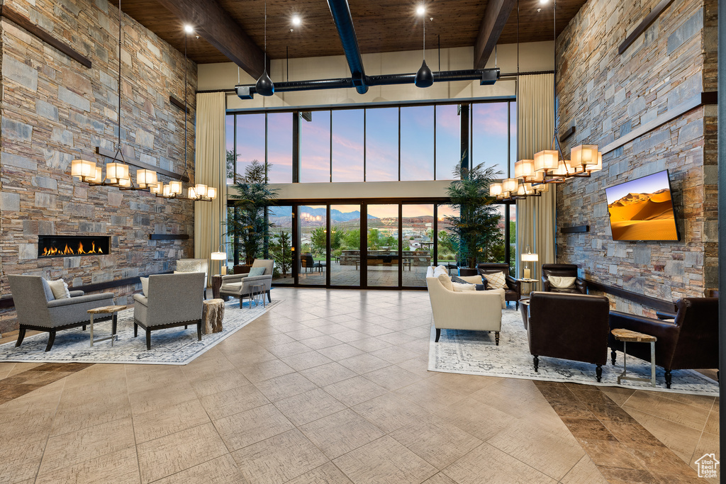 Community lobby with a towering ceiling and wood ceiling with exposed beams