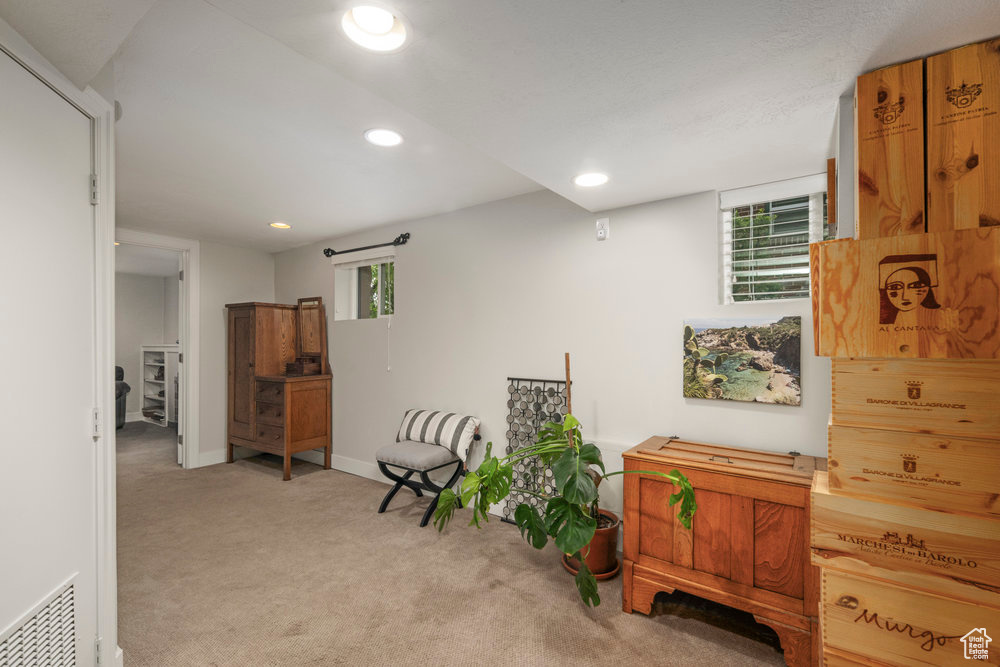 Sitting room featuring recessed lighting, baseboards, and light colored carpet