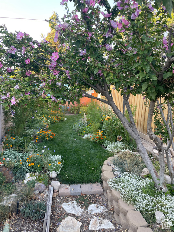 View of yard featuring fence