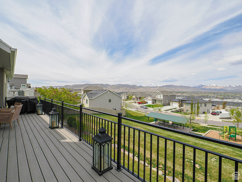 Wooden terrace with a mountain view and a residential view