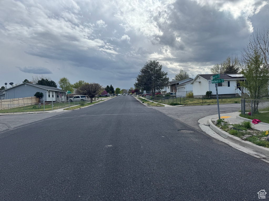 View of street with curbs, sidewalks, and a residential view