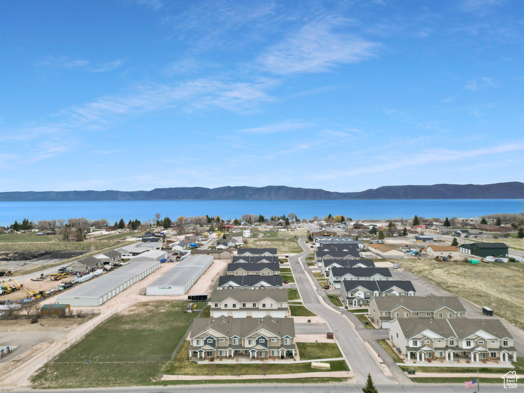 Birds eye view of property with a residential view and a water and mountain view
