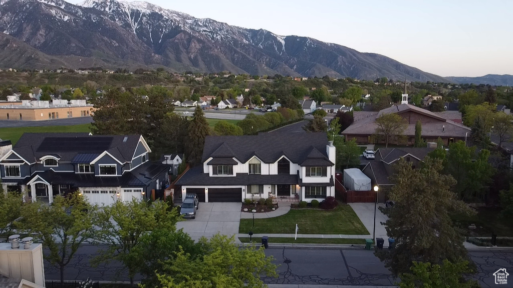 Aerial view of residential area with a mountain backdrop