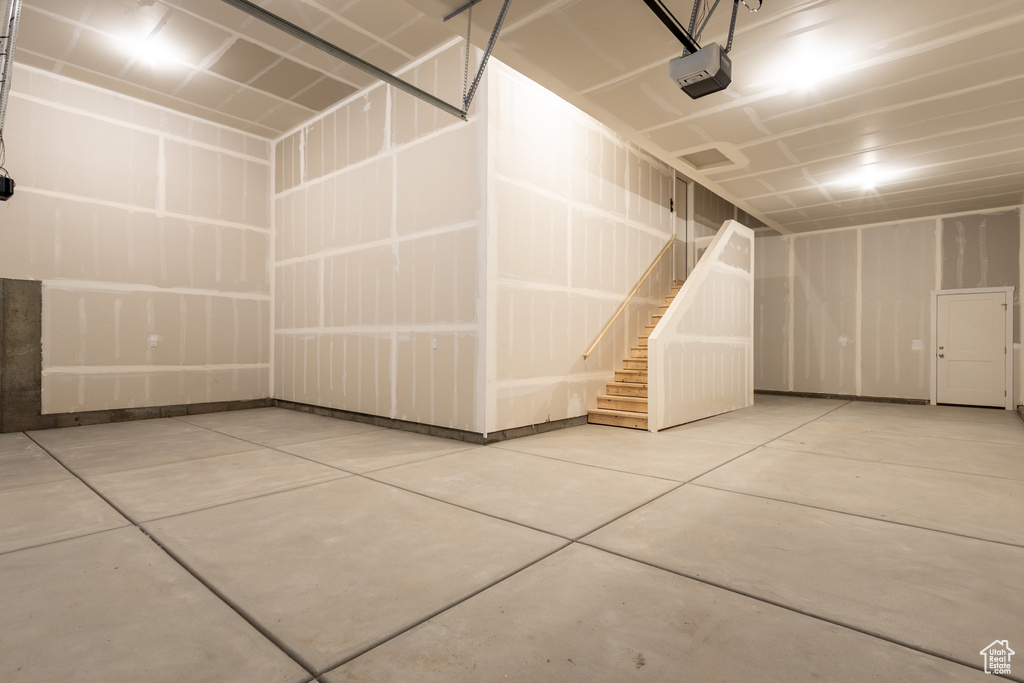 Garage featuring a garage door opener