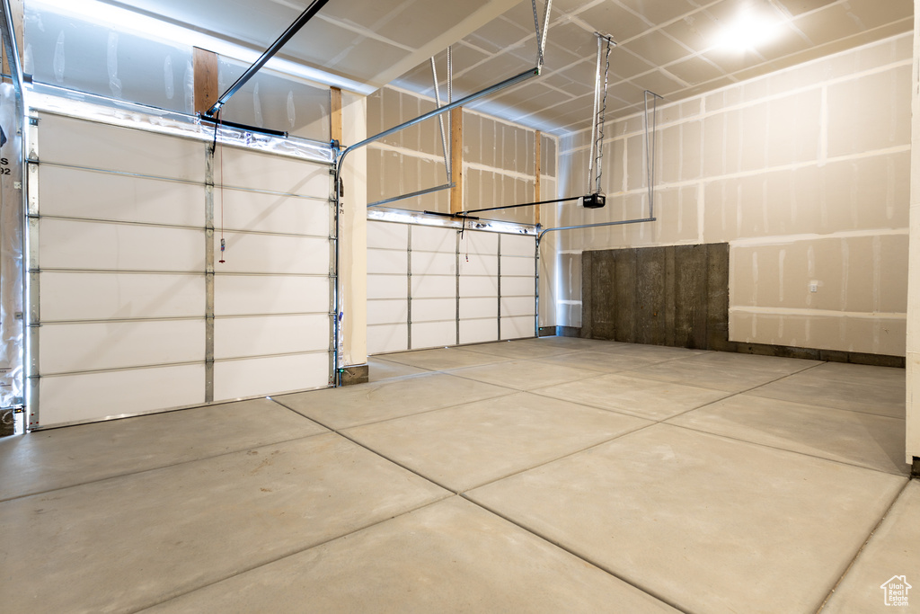 Garage featuring a garage door opener