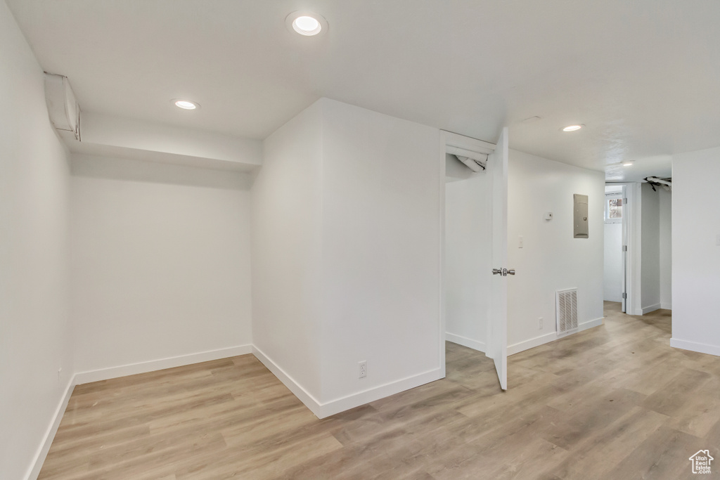 Finished basement featuring recessed lighting, visible vents, baseboards, and light wood-type flooring